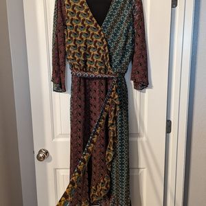 This dress is a size 22/24 W it is multicolor and has a built around the waist.